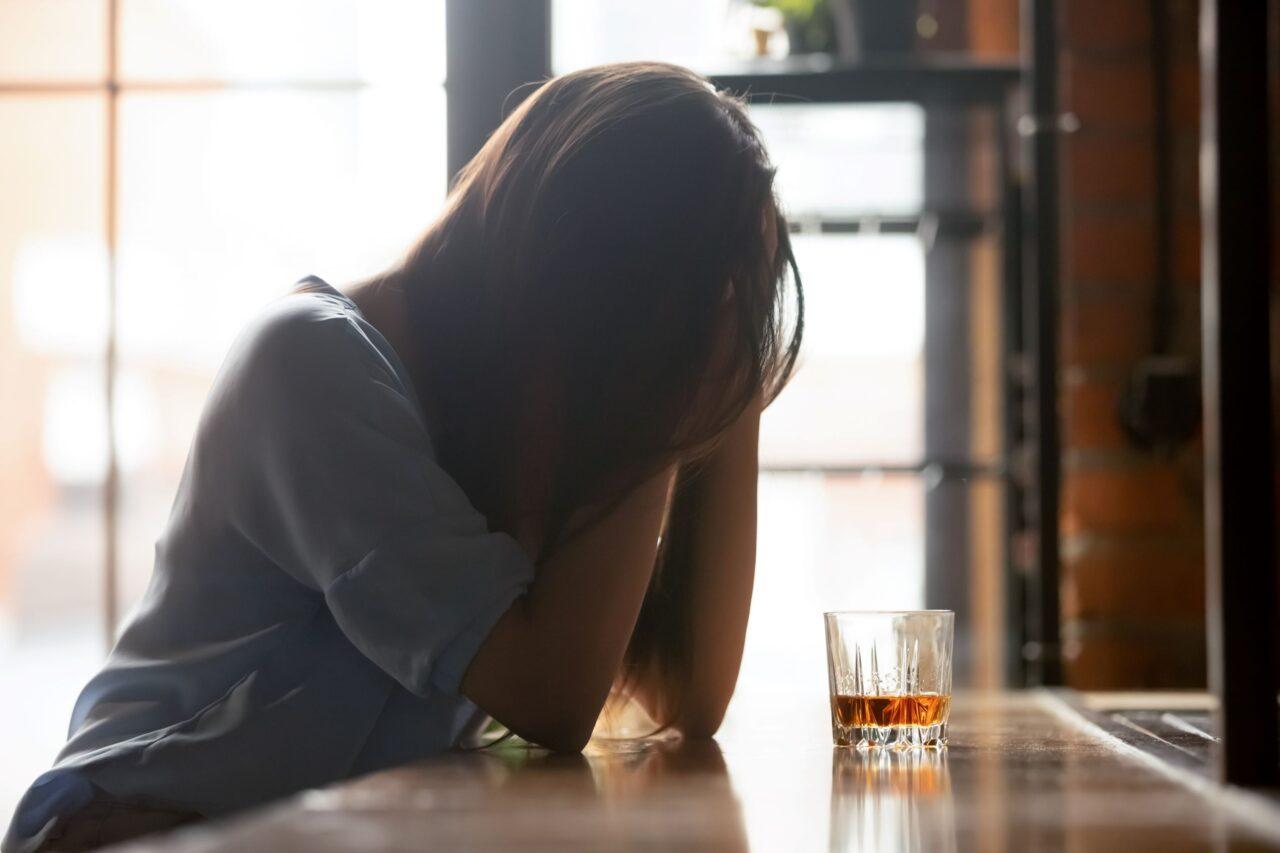 alcohol use disorder and medication assisted treatment. woman with alcoholism